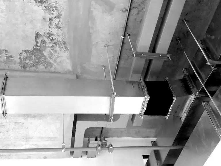 Air-handling ducts and rooftop equipment on a parking structure