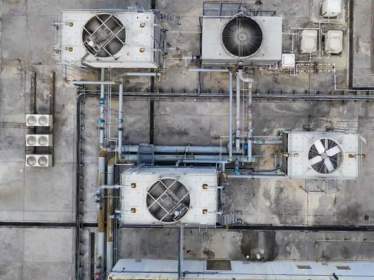 Rooftop HVAC equipment protected with Bird Barrier bird control by Roofco