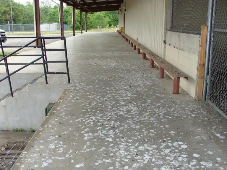 Loading dock at a medical facility with overhead pipes and conduit